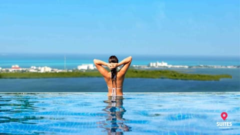 Outdoor pool, open 7:00 AM to 11:00 PM, pool umbrellas, sun loungers