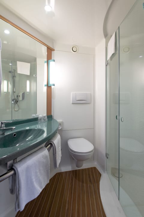 Shower, eco-friendly toiletries, hair dryer, towels