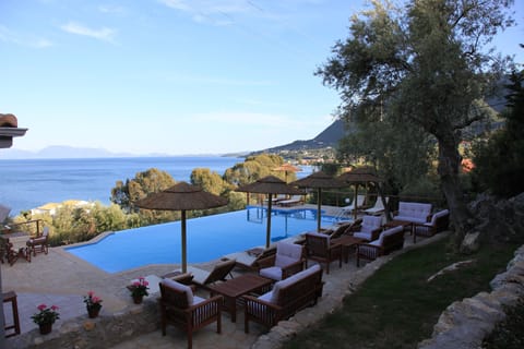 Seasonal outdoor pool, open 9 AM to 9 PM, pool umbrellas, sun loungers