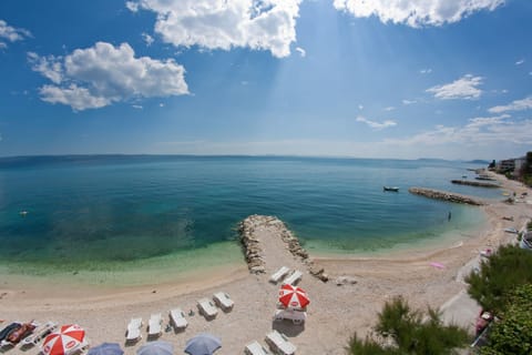 On the beach, sun loungers, beach umbrellas, beach towels