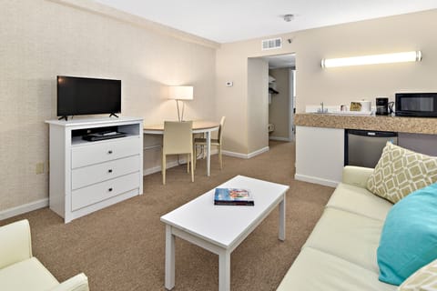Suite, 1 King Bed | Living room | 50-inch Smart TV with cable channels, TV, streaming services