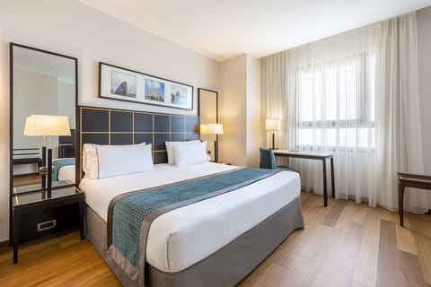 Triple Room, City View | Minibar, in-room safe, desk, laptop workspace