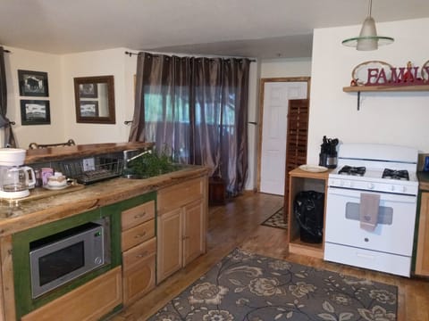 Family House, 2 Bedrooms, Garden View | Private kitchen | Coffee/tea maker, cookware/dishes/utensils, dining tables