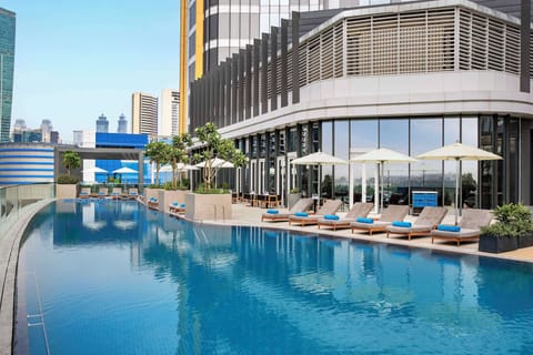 Outdoor pool, pool umbrellas, sun loungers