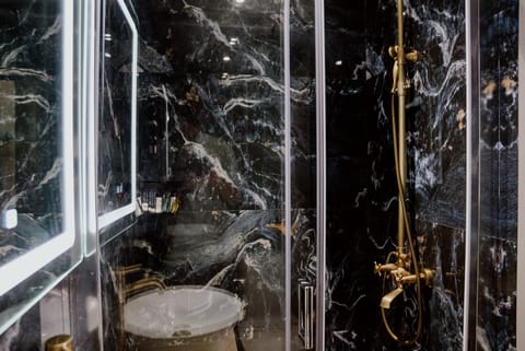 LUXURY ROOM 107 | Bathroom | Slippers, towels, soap, shampoo