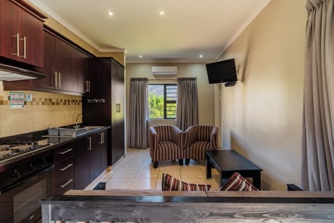 Bungalow (5 Sleeper Rondavel) | Private kitchen | Full-size fridge, microwave, stovetop, electric kettle
