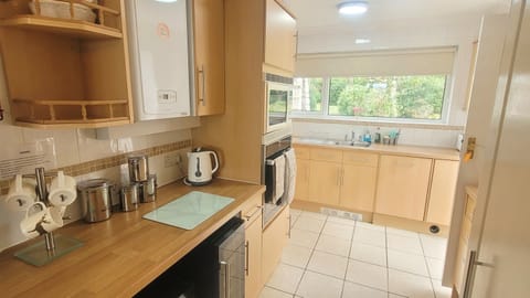 Fridge, electric kettle, toaster, cookware/dishes/utensils