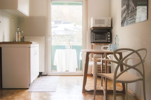 Standard Apartment, 1 King Bed, Balcony | Private kitchen | Microwave, stovetop, toaster, highchair