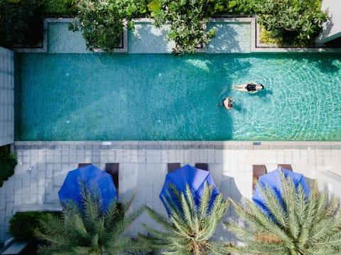 Outdoor pool, open 6:00 AM to 8:00 PM, pool umbrellas