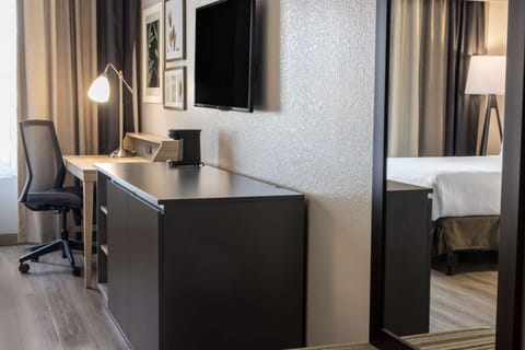 Desk, laptop workspace, blackout drapes, iron/ironing board