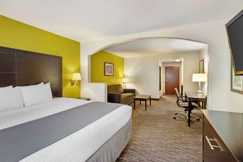 Premium bedding, desk, laptop workspace, blackout drapes