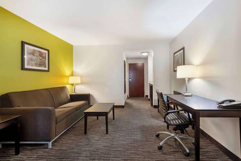 Premium bedding, desk, laptop workspace, blackout drapes