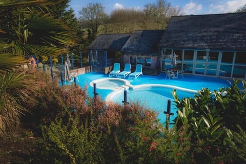 Indoor pool, seasonal outdoor pool, pool umbrellas, sun loungers