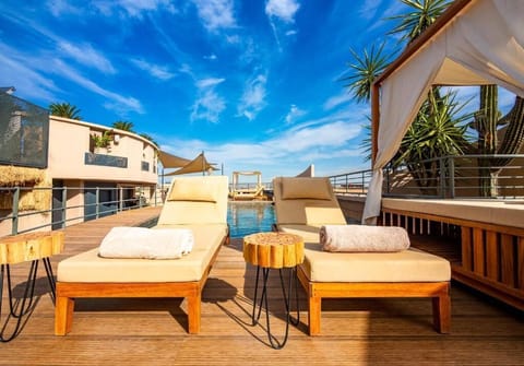 Outdoor pool, open 8:00 AM to 7:00 PM, sun loungers