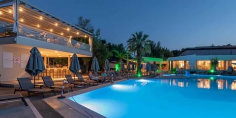 Seasonal outdoor pool, open 10:00 AM to 6:00 PM, pool umbrellas