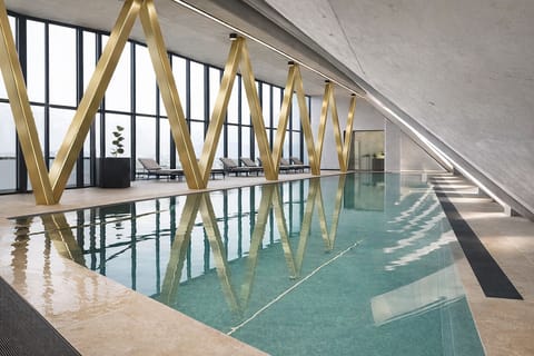 Indoor pool, open 7:00 AM to 10:00 PM, pool umbrellas, sun loungers