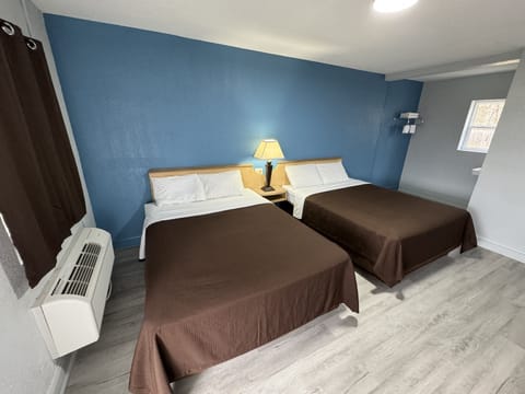 Room, 2 Queen Beds, Smoking, Garden View | Free WiFi, bed sheets