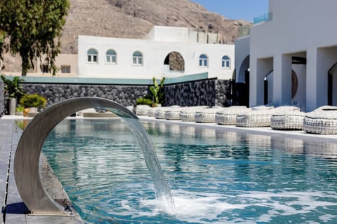 Seasonal outdoor pool, open 10:00 AM to 7:00 PM, pool umbrellas