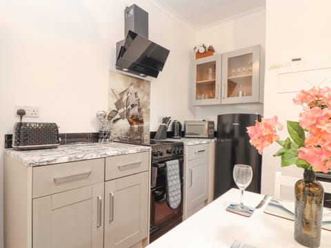 Fridge, electric kettle, toaster, cookware/dishes/utensils