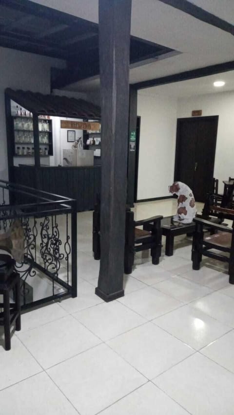 Family Triple Room | Living area | 32-inch flat-screen TV with cable channels