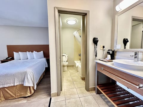 Suite, 1 Queen Bed, Non Smoking | Desk, iron/ironing board, free WiFi, bed sheets