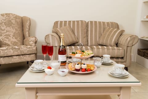 Deluxe Double Room | Living room | Flat-screen TV, DVD player, heated floors