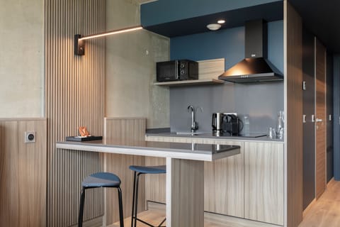 Premium Double or Twin Room, Pool Access | Living area | 55-inch flat-screen TV with satellite channels, books