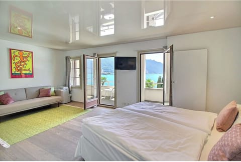 Junior Suite Signature, Balcony & Lake View | Premium bedding, minibar, in-room safe, blackout drapes