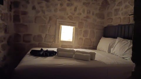 Desk, laptop workspace, bed sheets