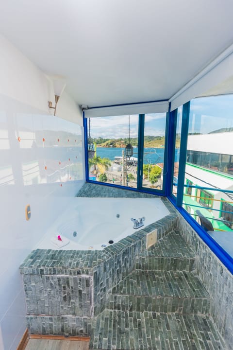 Exclusive Room | Bathroom | Combined shower/tub, rainfall showerhead, soap, toilet paper
