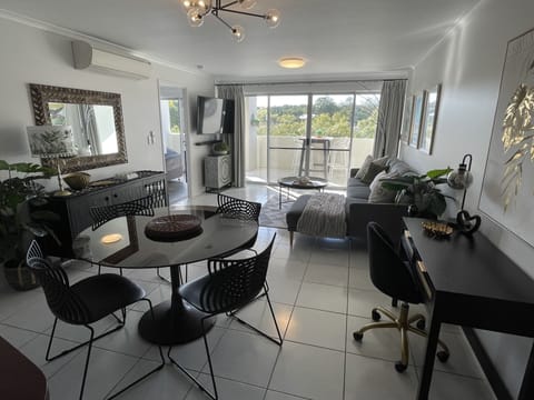 Premium Apartment | Living area | 55-inch flat-screen TV with digital channels