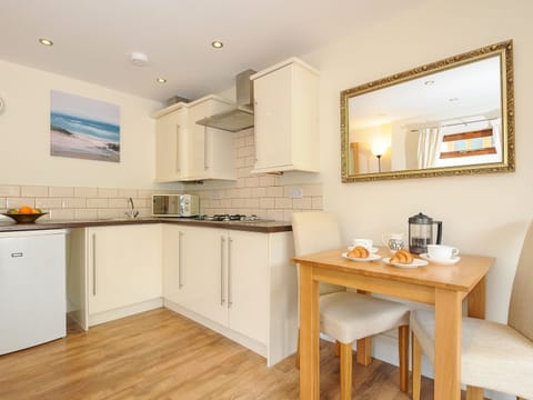 Fridge, electric kettle, cookware/dishes/utensils