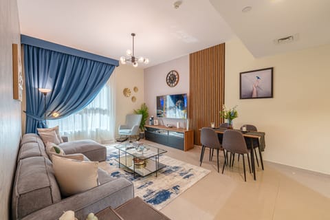 Comfort Apartment | Living area | 65-inch Smart TV with cable channels, Netflix, streaming services