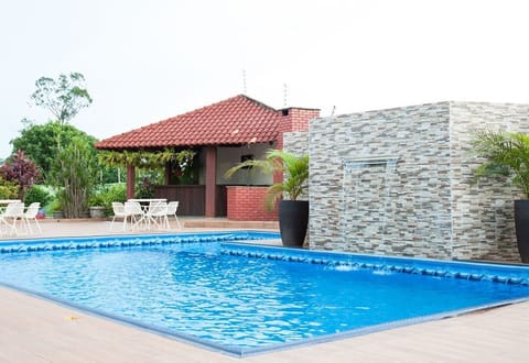 Outdoor pool, open 9:00 AM to 10:00 PM, pool umbrellas, sun loungers