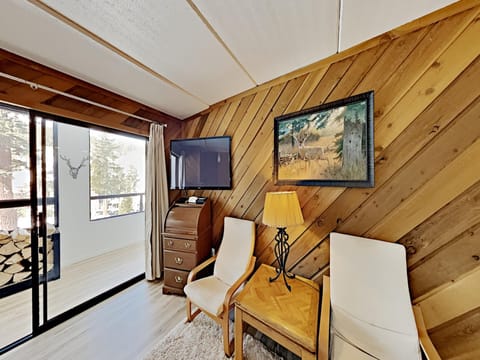 Bright Living Room And Sunroom With Slope Views