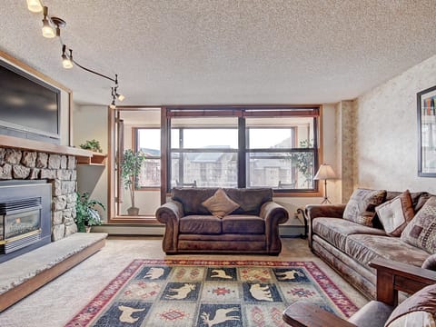 Cozy living room featuring large windows