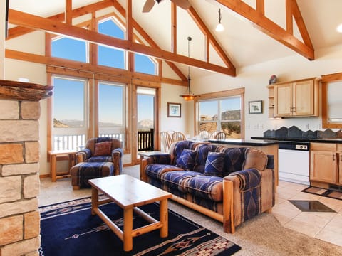 Comanche Peak 39 - a SkyRun RMNP Property - Comanche Peak 39 - The condo's main living area boasts breathtaking mountain views from its large floor to ceiling windows, can be enjoyed from either the comfortable queen sleeper sofa or loveseat.