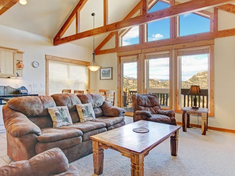 Mount Acoma 38 - a SkyRun RMNP Property - Mount Acoma 38 - The condo's main living area boasts breathtaking mountain views from its large floor to ceiling windows, can be enjoyed from either the comfortable queen sleeper sofa or loveseat.