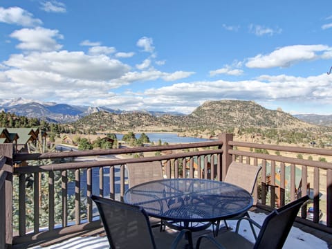 Ptarmigan Mountain 202 - a SkyRun RMNP Property - Ptarmigan Mountain 202 - Patio seating on the condo's deck surrounded by beautiful lake and mountain views.