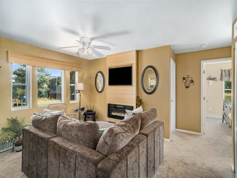 Wild Flower -- EV #3197 - a SkyRun RMNP Property - Wild Flower - The front door leads to the cozy living area with a fireplace, a Lovesac sectional that easily transforms into an additional sleeping area, and a flat screen TV