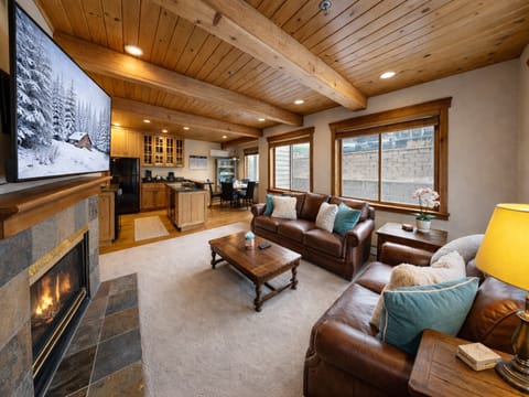Sink into warm leather sofas by the crackling fireplace while your favorite shows play on the big screen above.