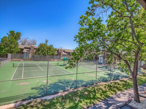 Tennis courts located right outside you backdoor.