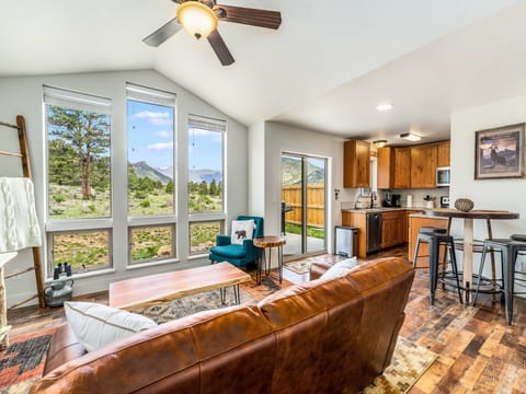 Serenity in the Rockies -- 20-NCD0406 - a SkyRun RMNP Property - Serenity in the Rockies - Open concept living area, serene views, open to dining area and kitchen. NOTE: table has been updated.