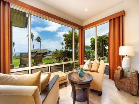 living room area with garden and ocean views