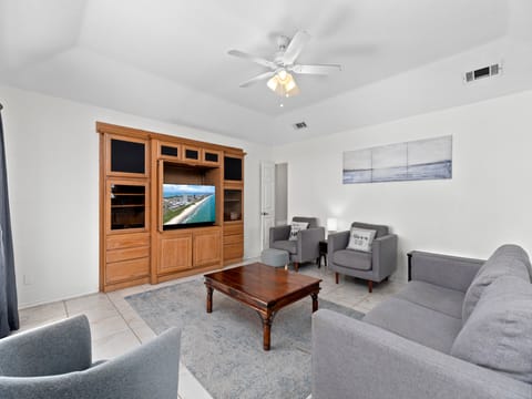 Spacious Living area surrounding flat screen TV