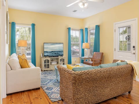 This cute cottage provides the perfect living area for relaxing in your down time. Plenty of seating is featured with a television for entertainment.
