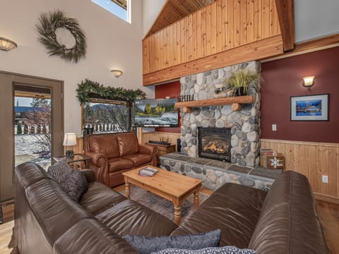 Cozy living area with gas fireplace and TV with streaming options