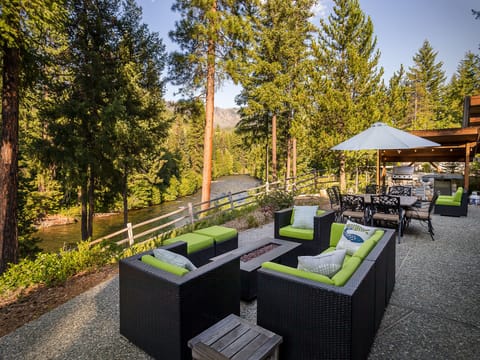 Patio propane fire pit seating with a view of the Chiwawa River