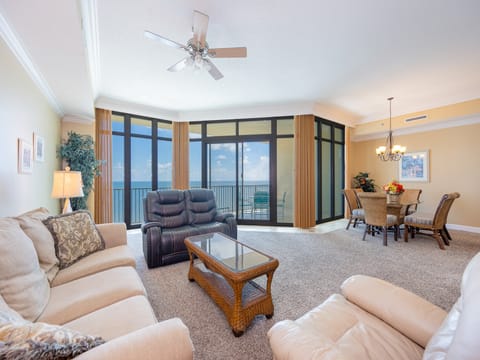 Feel the warmth of the sun while you enjoy a movie night in this inviting living room, surrounded by family