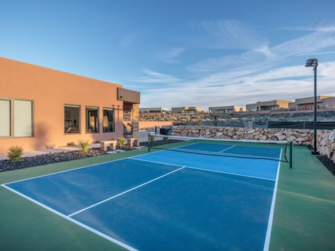 This private pickleball court is located on the side of the house and has outdoor lights for late night fun!